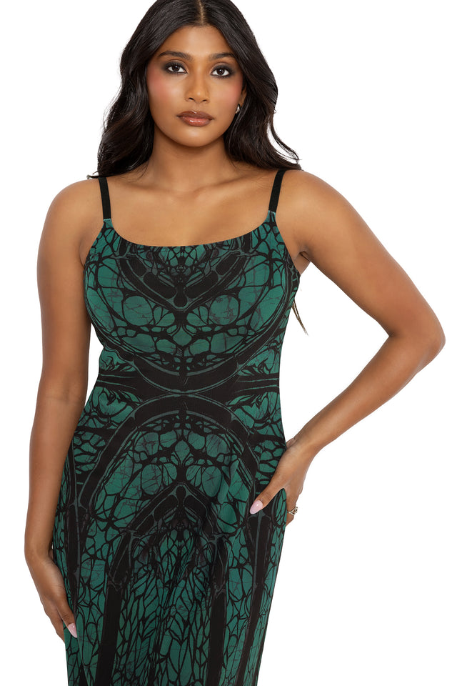 Alternative goth maxi dress featuring cathedral web artwork, sheer mesh layers and a flattering fitted bodice with flowing A-line skirt. This fantasy witch dress combines dark academia, whimsigoth and modern pagan fashion with elegant gothic architecture inspired details.