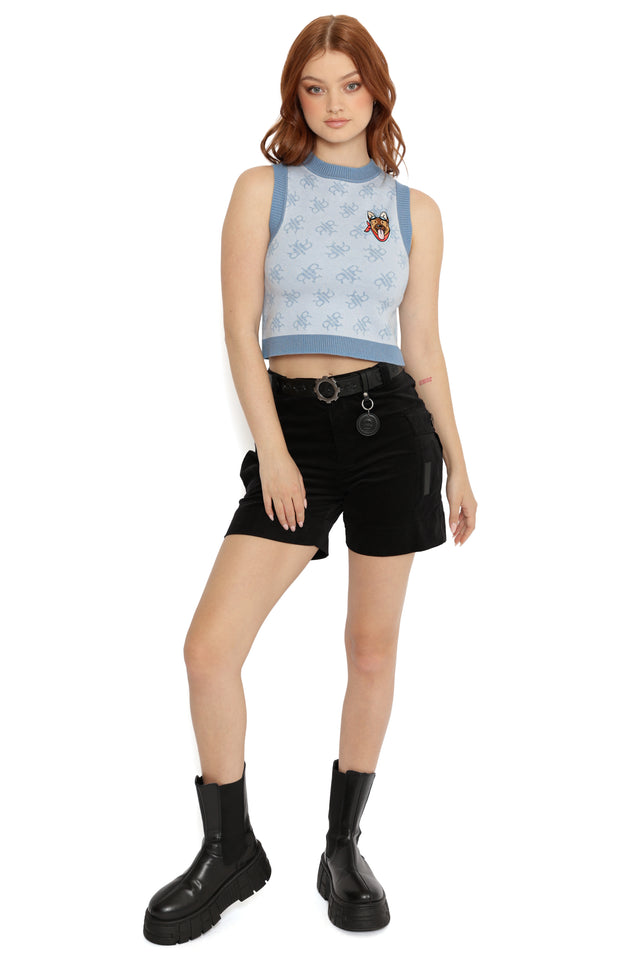 Model wearing Fallout x BlackMilk Red Rocket Station Knit Vest featuring jacquard rocket logo pattern and embroidered Vault Boy patch.