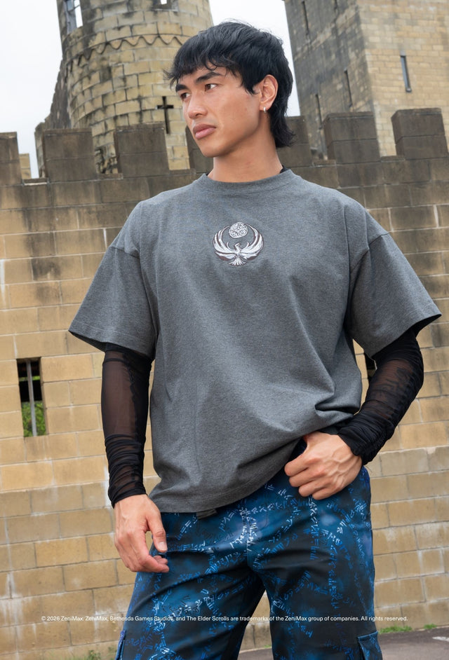 Nightingale Armour oversized grey tee with Nightingale crest graphic styled with cargo pants and mesh sleeves